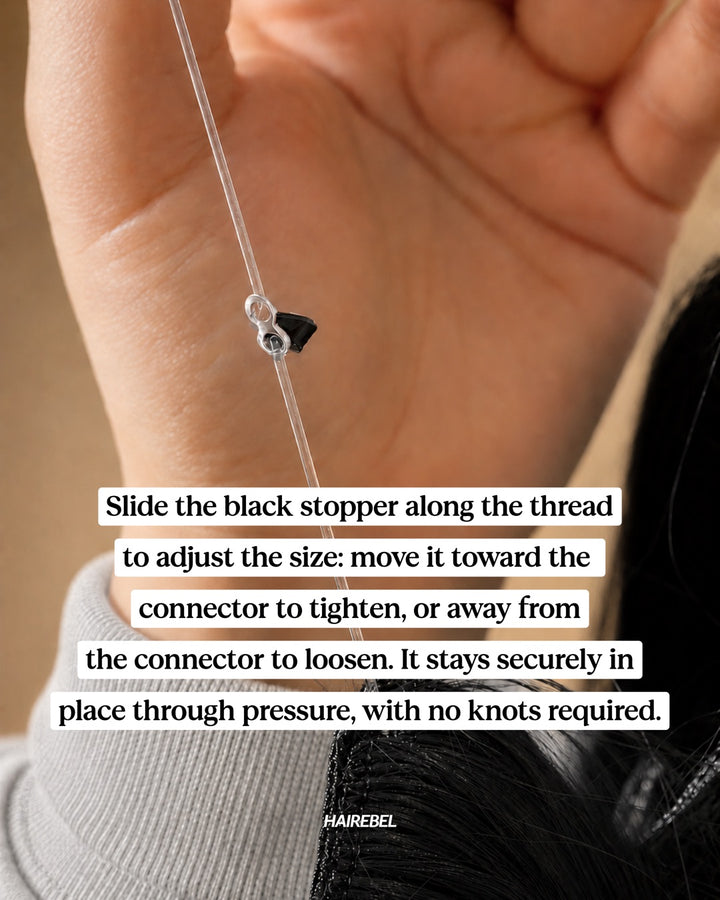 Slide the black stopper along the thread to adjust the size